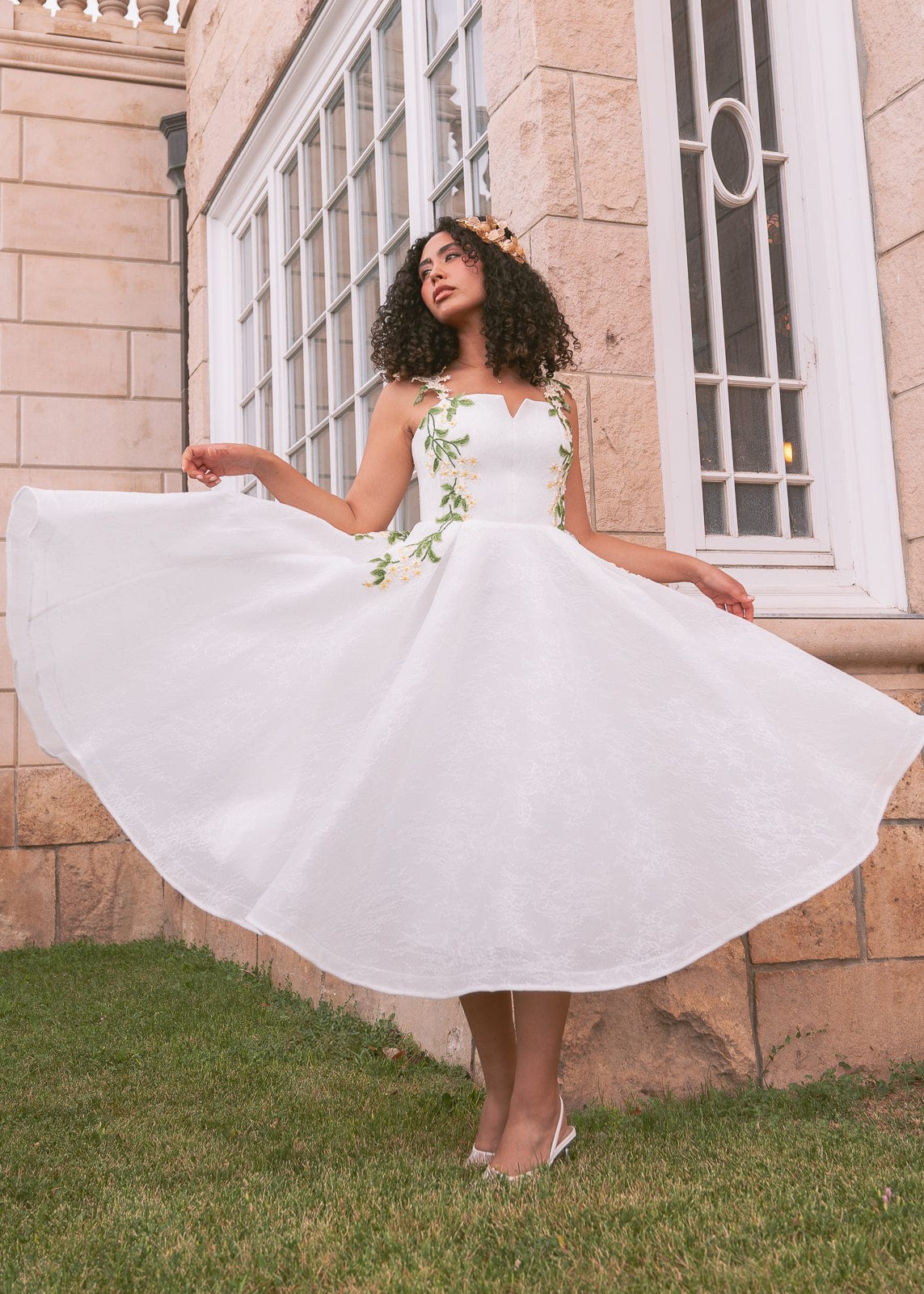 chic size inclusive model wearing JessaKae Lily Petal Dress