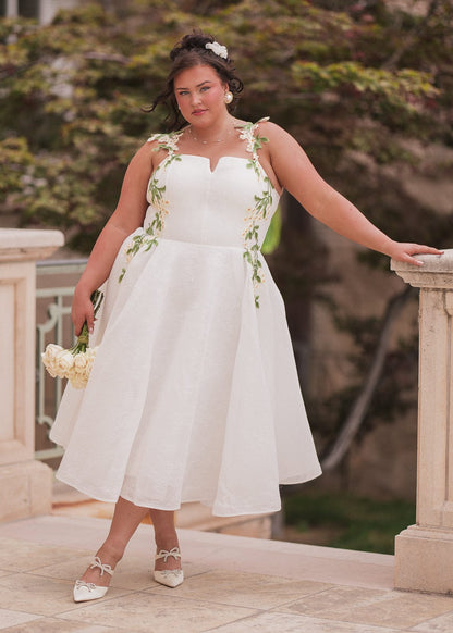 chic size inclusive model wearing JessaKae Lily Petal Dress