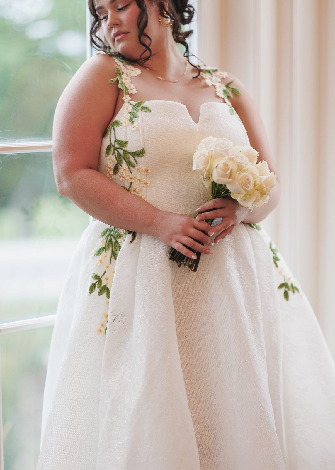 chic size inclusive model wearing JessaKae Lily Petal Dress