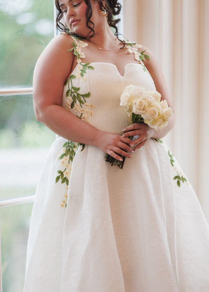 chic size inclusive model wearing JessaKae Lily Petal Dress