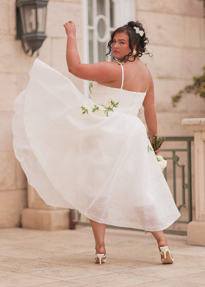 chic size inclusive model wearing JessaKae Lily Petal Dress