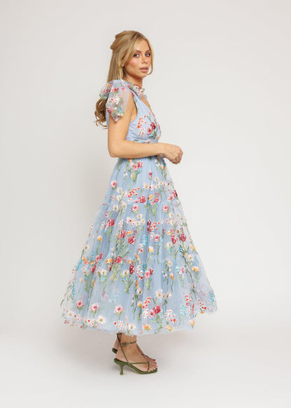 chic size inclusive model wearing JessaKae Margaret Floral Midi Dress Blue Dresses
