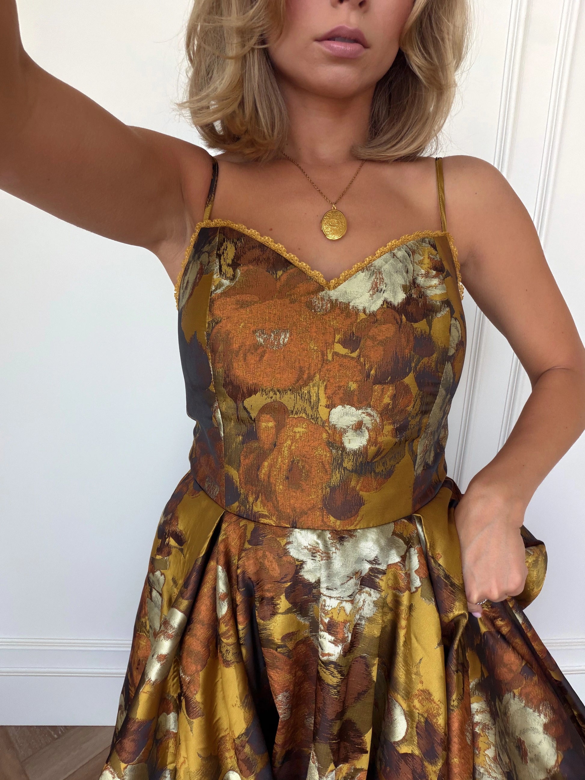 A woman in a red dress posing for a picture